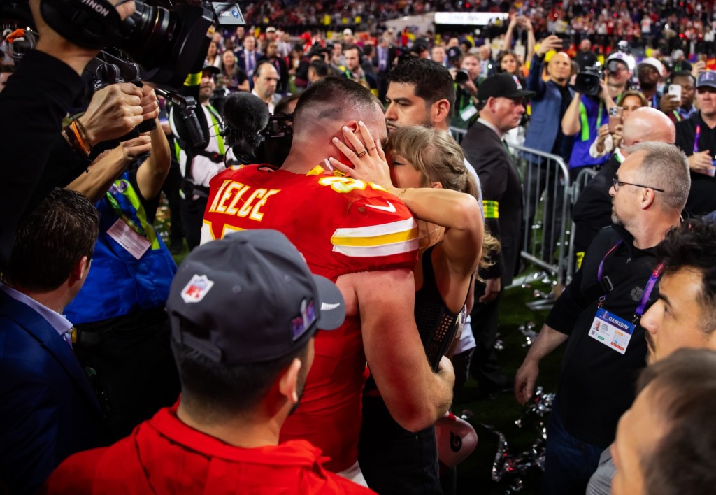 Feb 11, 2024; Paradise, Nevada, USA; Kansas City Chiefs tight end Travis Kelce (87) kisses girlfriend Taylor Swift as they celebrate after defeating the San Francisco 49ers in Super Bowl LVIII at Allegiant Stadium.