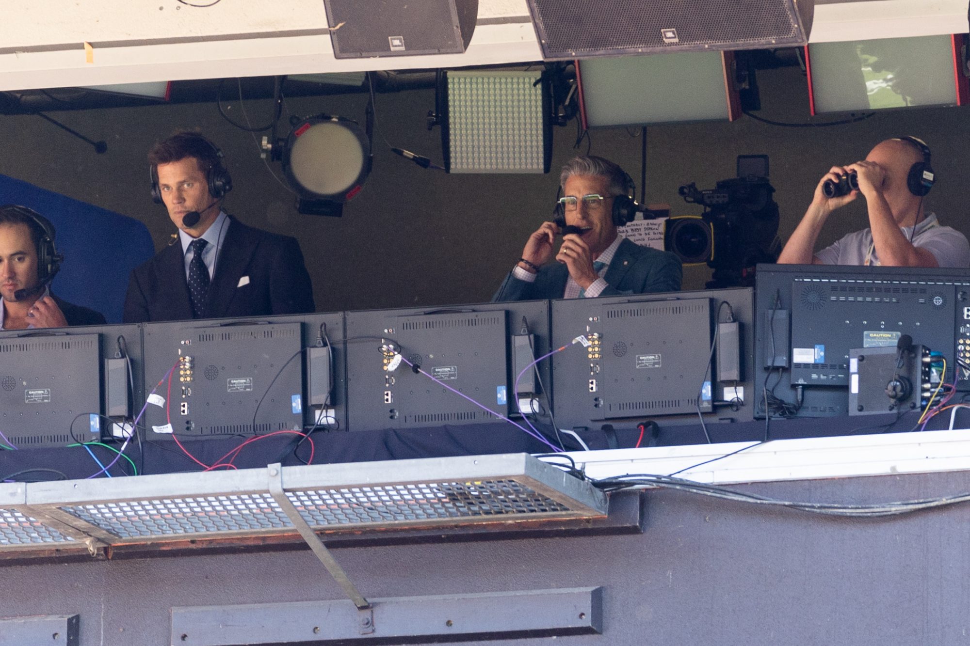 Sep 8, 2024; Cleveland, Ohio, USA; Fox Sports announcer Tom Brady, left, in the broadcast booth for the game between the Cleveland Browns and the Dallas Cowboys at Huntington Bank Field.