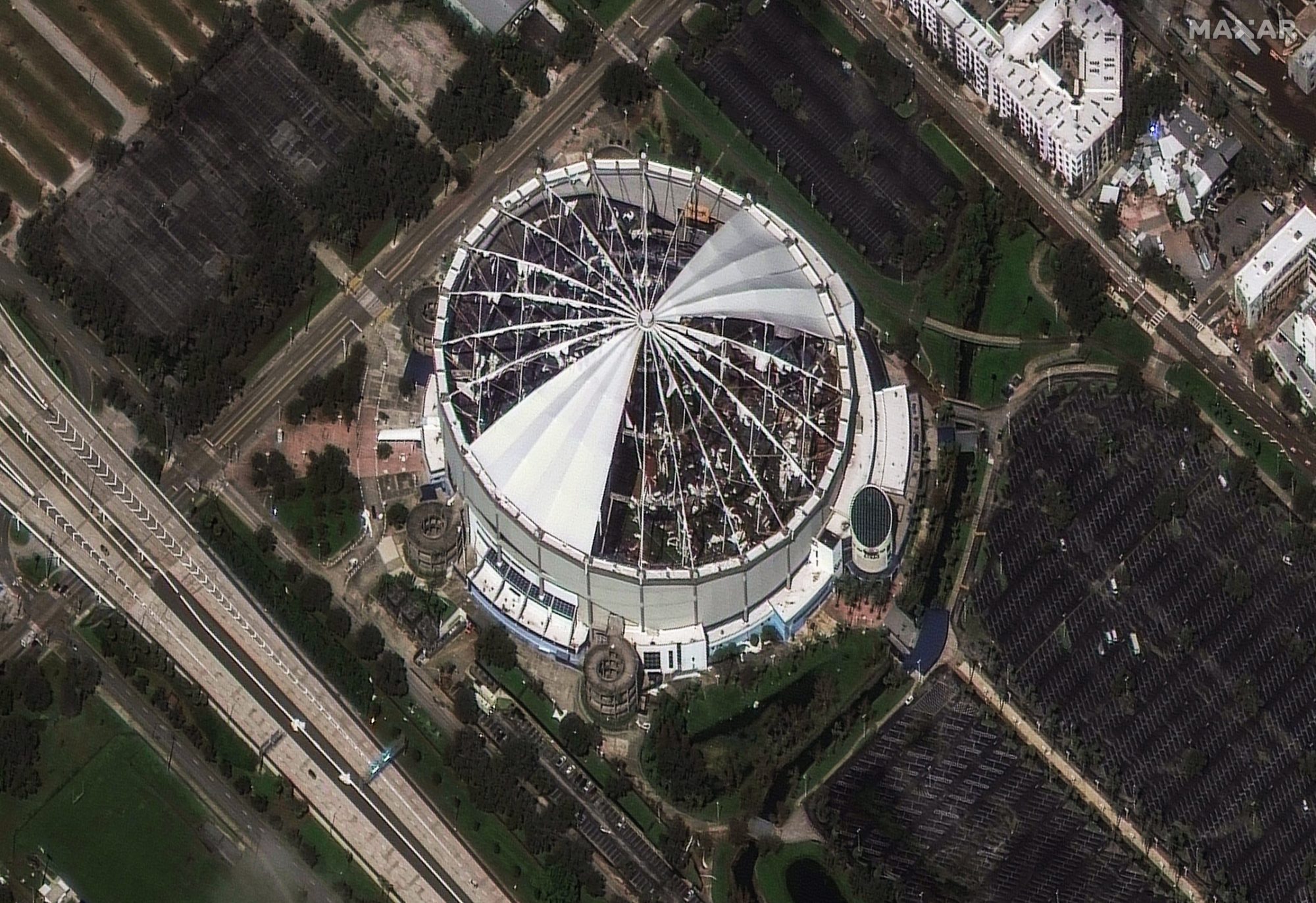 The roof of Tropicana Field, home of the Tampa Bay Rays MLB team, was torn off by Hurricane Milton's powerful winds. Satellite imagery from Maxar shows the destruction on Oct. 10, 2024. Prior to landfall, the stadium was converted into a base camp for emergency responders.