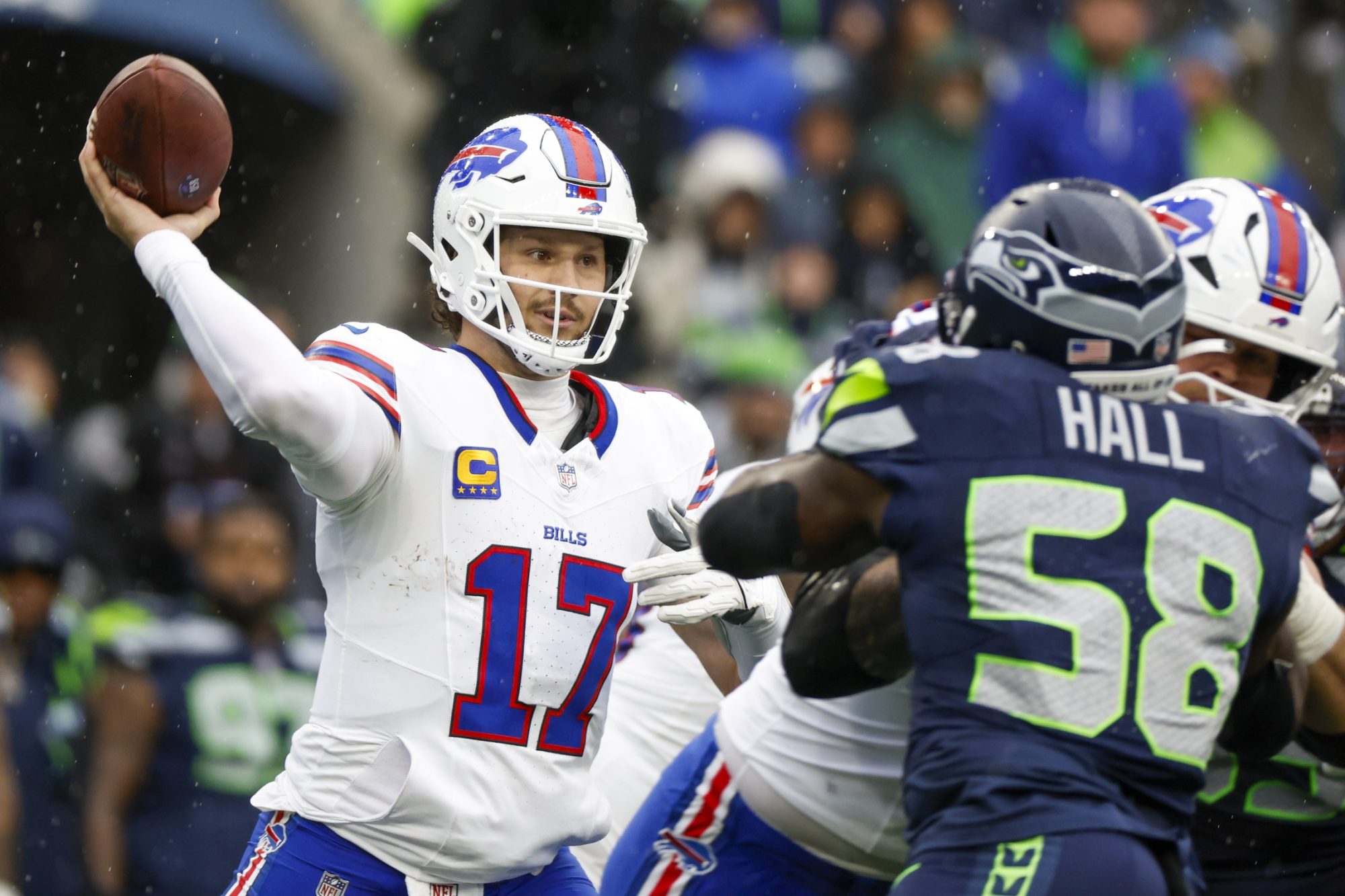 Oct 27, 2024; Seattle, Washington, USA; Buffalo Bills quarterback Josh Allen (17) passes against the Seattle Seahawks during the second quarter at Lumen Field.