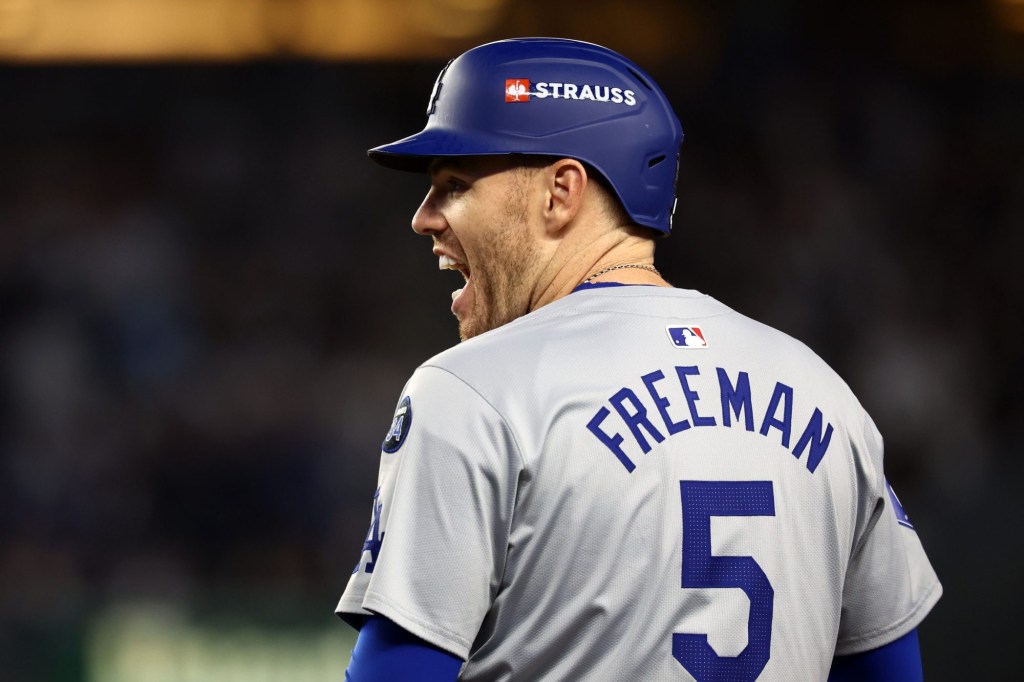 Oct 29, 2024; Bronx, New York, USA; Los Angeles Dodgers first baseman Freddie Freeman (5) reacts after hitting a RBI single against the New York Yankees in the fifth inning during game four of the 2024 MLB World Series at Yankee Stadium.