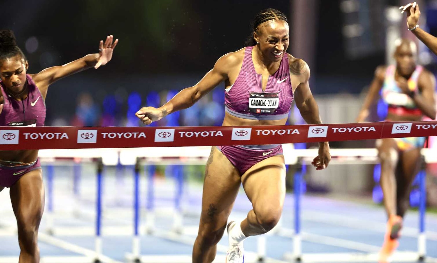 Hurdlers Masai Russell and Jasmine Camacho-Quinn in a race