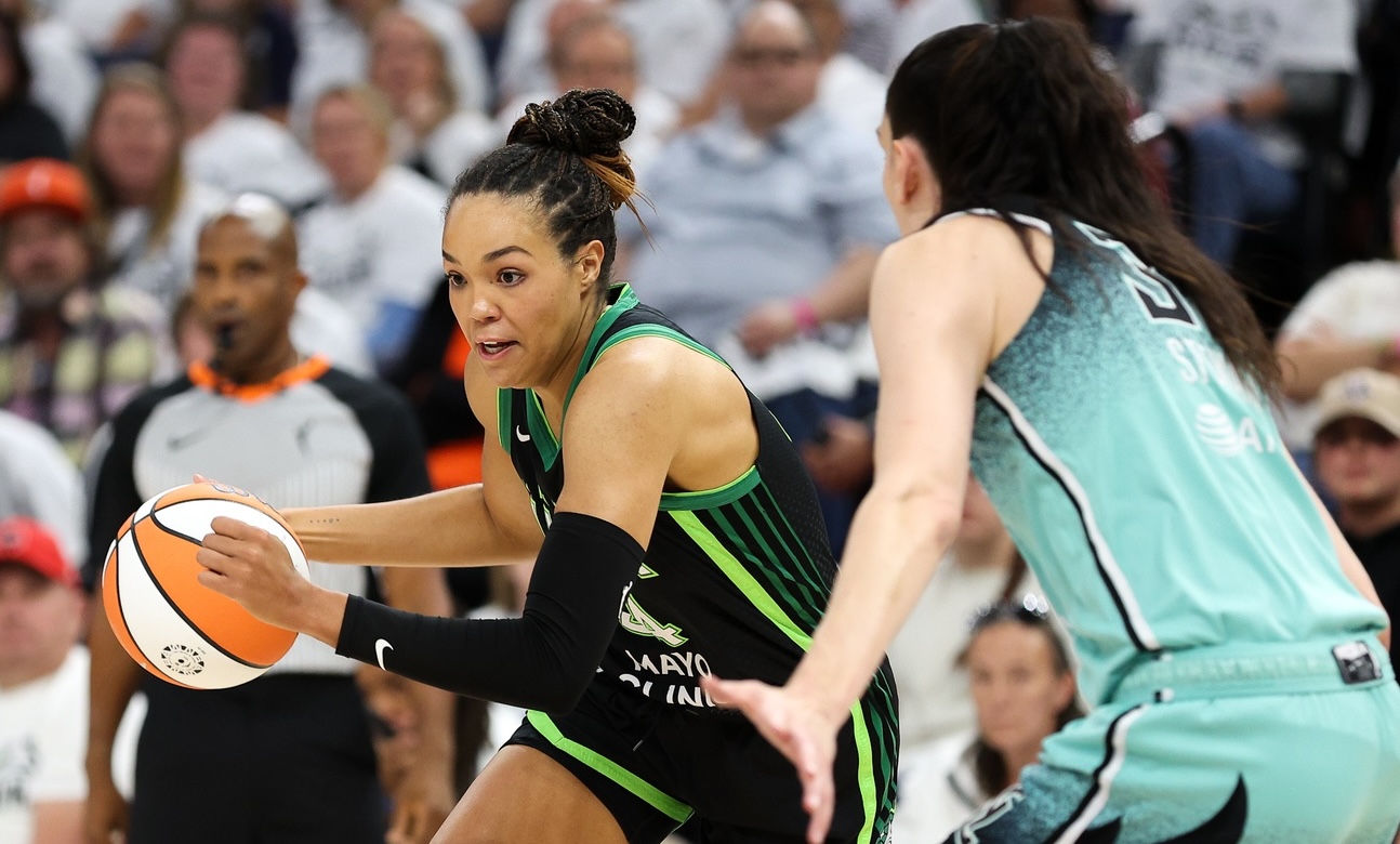 Napheesa Collier (left) drives against Breanna Stewart