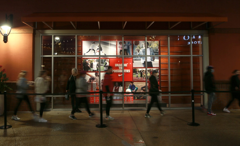 A line of Black Friday shoppers streams into the Nike Store at Tanger Outlets in Pooler.