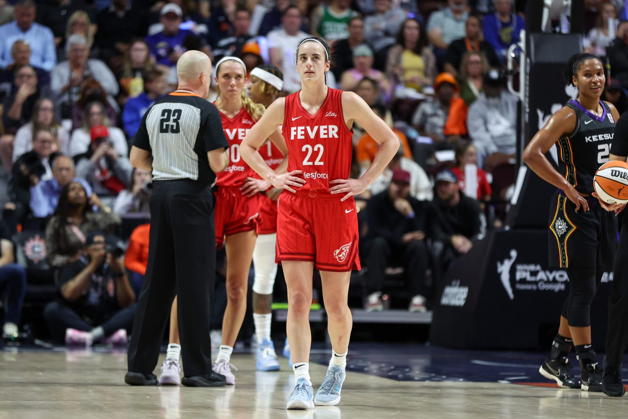 Sep 25, 2024; Uncasville, Connecticut, USA; Indiana Fever guard Caitlin Clark (22) reacts during the first half against the Connecticut Sun during game two of the first round of the 2024 WNBA Playoffs at Mohegan Sun Arena.