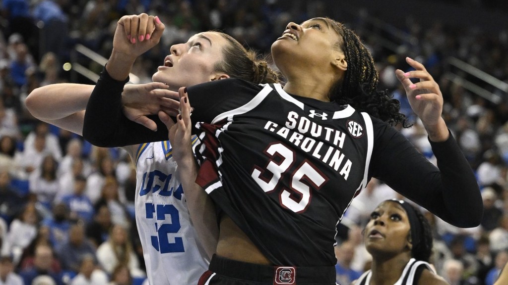 Nov 24, 2024; Los Angeles, California, USA; South Carolina Gamecocks center Sakima Walker (35) and UCLA Bruins forward Angela Dugalic (32) jockey for rebounding position during the fourth quarter at Pauley Pavilion presented by Wescom. Mandatory