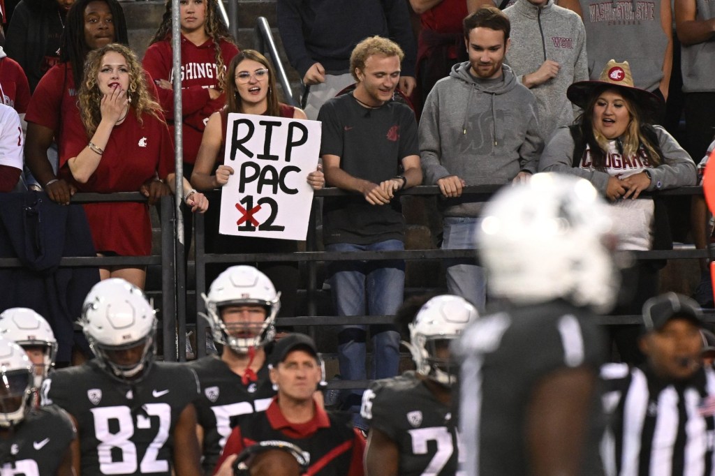 Sep 23, 2023; Pullman, Washington, USA; Washington State Cougars fans holds up a sign about the Pac @ during a game against the Oregon State Beavers in the second half at Gesa Field at Martin Stadium. Washington State won 38-35.