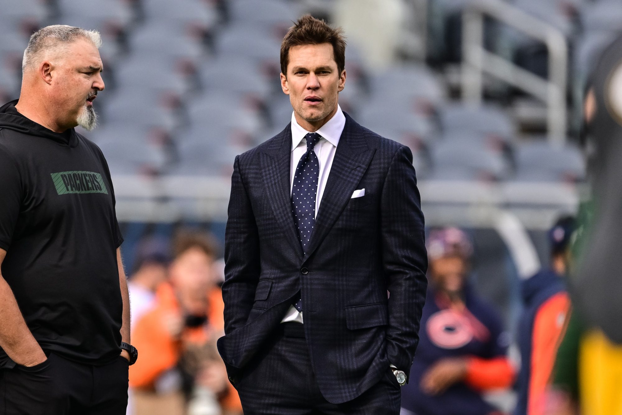 Nov 17, 2024; Chicago, Illinois, USA; Former quarterback and current NFL announcer Tom Brady looks on before the game between the Chicago Bears and Green Bay Packers at Soldier Field.