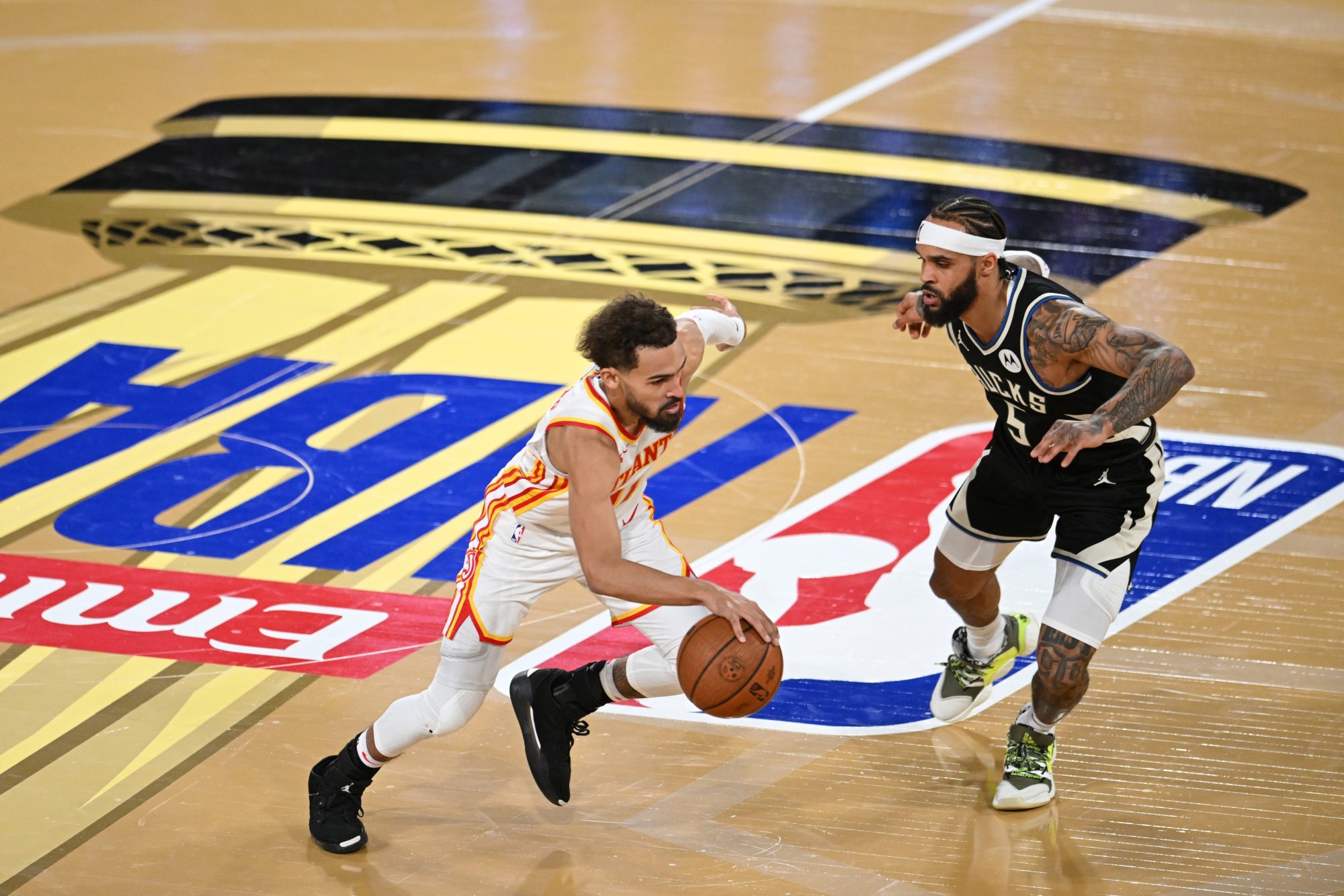 Dec 14, 2024; Las Vegas, Nevada, USA; Atlanta Hawks guard Trae Young (11) controls the ball against Milwaukee Bucks guard Gary Trent Jr. (5) during the fourth quarter in a semifinal of the 2024 Emirates NBA Cup at T-Mobile Arena.