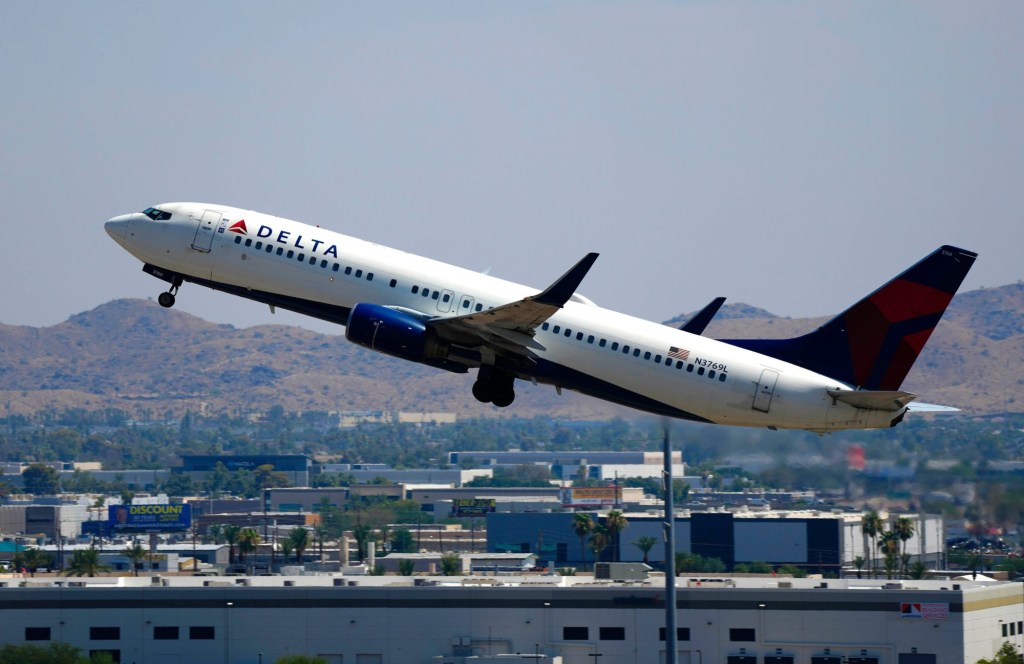 A Delta flight takes off from Phoenix Sky Harbor International Airport on July 12, 2024, in Phoenix.