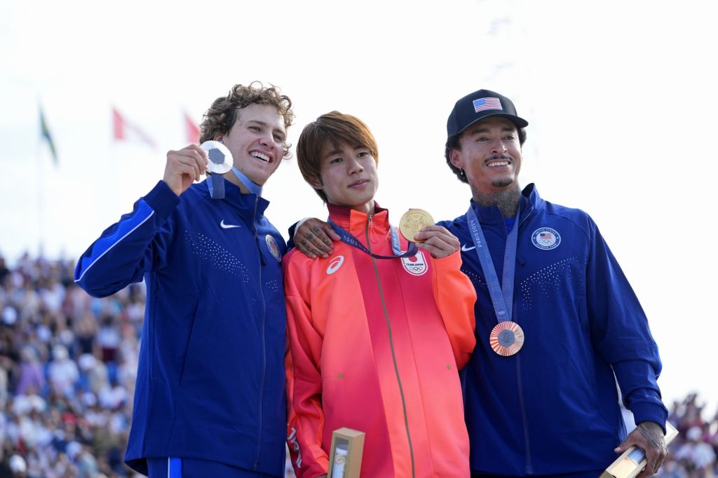 Jul 29, 2024; Paris, France; Jagger Eaton of the United States, Yuto Horigome of Japan, and Nyjah Huston of the United States pose for a photo on the podium after the mens street finals during the Paris 2024 Olympic Summer Games at La Concorde 3.
