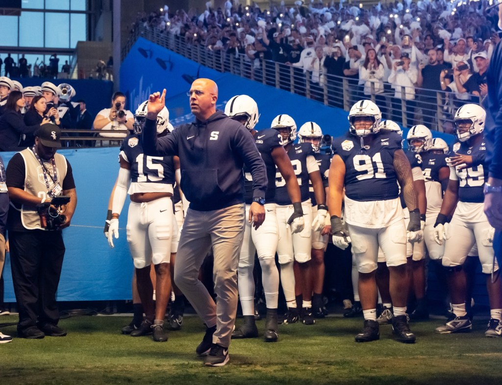 Dec 31, 2024; Glendale, AZ, USA; Penn State Nittany Lions head coach James Franklin leads his players onto the field prior to the game against the Boise State Broncos in the Fiesta Bowl at State Farm Stadium.