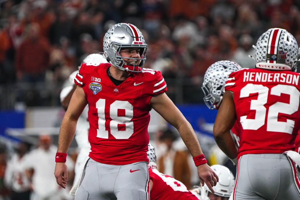 Ohio State quarterback Will Howard (18) yells instructions to his team during the College Football Playoff semifinal game against the Texas Longhorns in the Cotton Bowl at AT&T Stadium on Friday, Jan. 10, 2024 in Arlington, Texas.