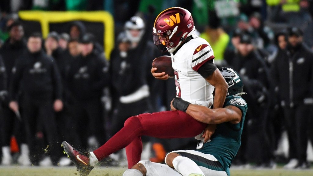 Jan 26, 2025; Philadelphia, PA, USA; Philadelphia Eagles linebacker Nolan Smith Jr. (3) sacks Washington Commanders quarterback Jayden Daniels (5) during the second half in the NFC Championship game at Lincoln Financial Field.