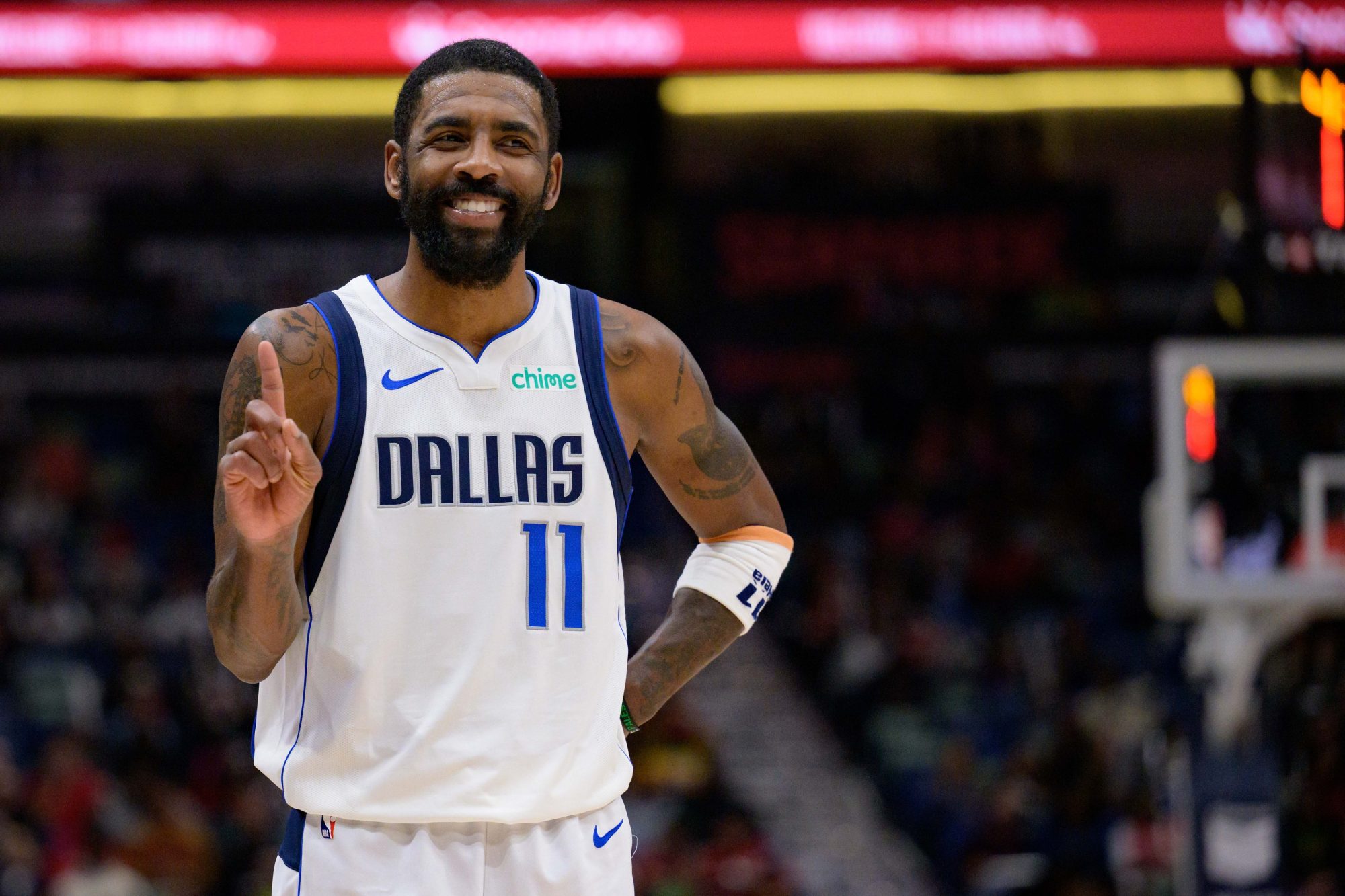 Jan 29, 2025; New Orleans, Louisiana, USA; Dallas Mavericks guard Kyrie Irving (11) reacts to fan during the second half against the New Orleans Pelicans at Smoothie King Center.