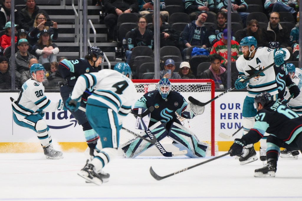 Jan 30, 2025; Seattle, Washington, USA; Seattle Kraken goaltender Joey Daccord (35) defends the goal against the San Jose Sharks during the third period at Climate Pledge Arena.