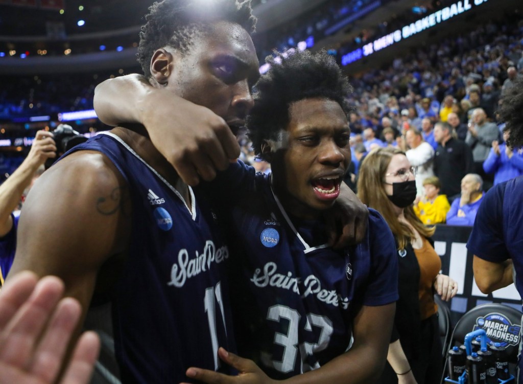 Saint Peter's KC Ndefo (left) and Jaylen Murray leave the court after the Peacocks' 67-64 win against Purdue to advance to the Elite Eight in the NCAA tournament at the Wells Fargo Center in Philadelphia, March 25, 2022.

Ncaa Basketball Ncaa Tournament Saint Peter S Vs Purdue In Sweet 16 Saint Peter S At Purdue