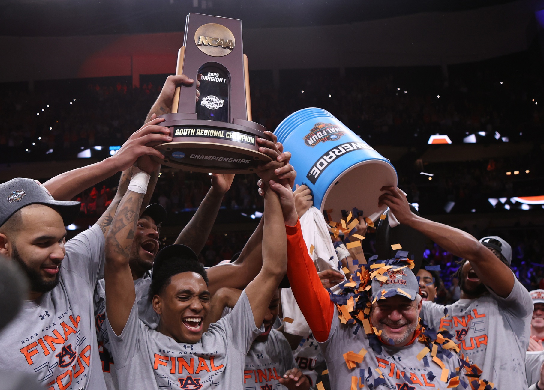 Mar 30, 2025; Atlanta, GA, USA; Auburn Tigers forward Johni Broome (4), left, guard Tahaad Pettiford (0) and head coach Bruce Pearl celebrate with teammates after winning the South Regional final of the 2025 NCAA tournament against the Michigan State Spartans at State Farm Arena.