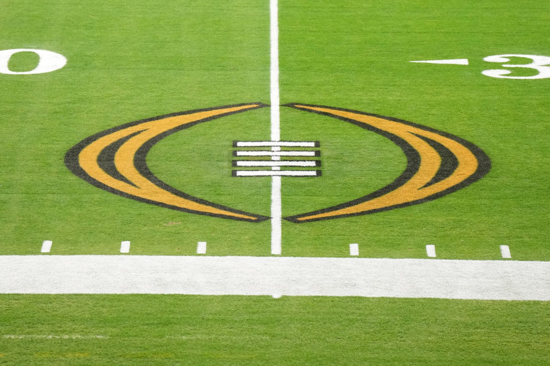 Dec 30, 2022; Glendale AZ, USA; The College Football Playoff logo on the field at State Farm Stadium, the site of the 2022 CFP Semifinal between the TCU Horned Frogs and the Michigan Wolverines and Super Bowl 57 (LVII).
