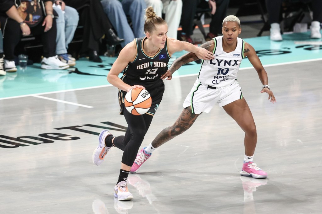 Oct 10, 2024; Brooklyn, New York, USA; New York Liberty forward Leonie Fiebich (13) controls the ball as Minnesota Lynx guard Courtney Williams (10) defends in the fourth quarter at Barclays Center.