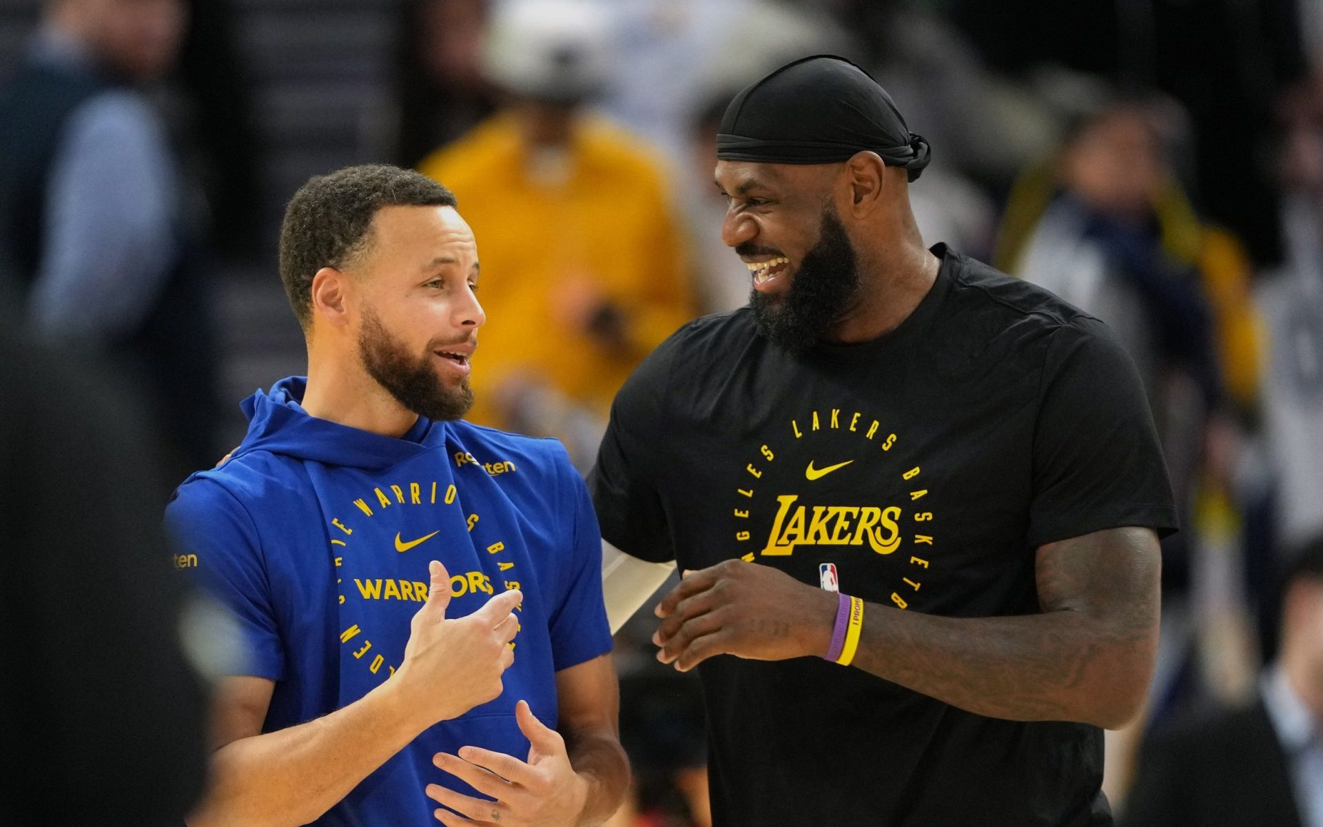 Dec 25, 2024; San Francisco, California, USA; Golden State Warriors guard Stephen Curry (left) and Los Angeles Lakers forward LeBron James (right) talk before the game at Chase Center.