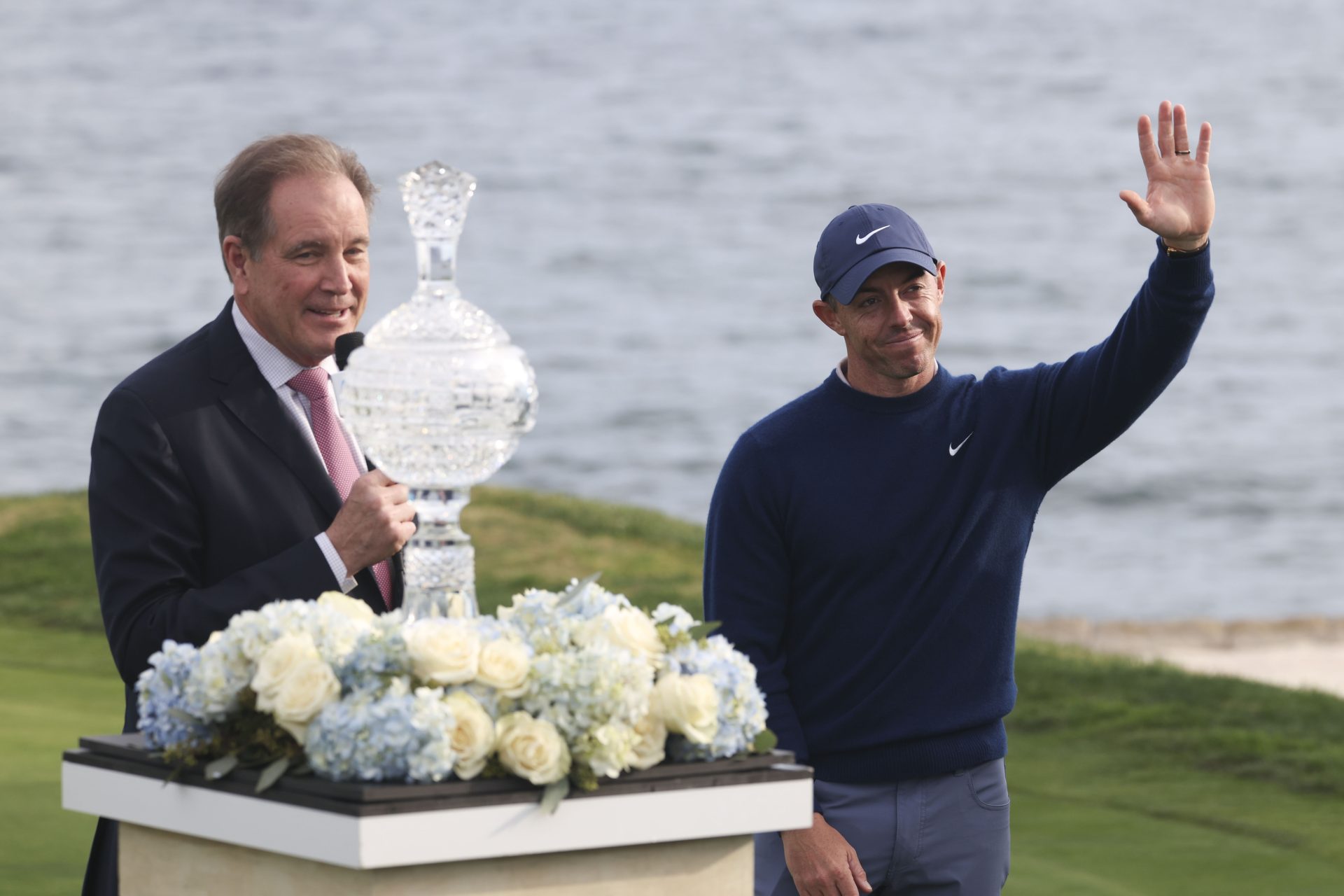 Feb 2, 2025; Pebble Beach, California, USA; Rory McIlroy (right) is interviewed by CBS broadcaster Jim Nantz (left) on the 18th hole during the final round of the AT&T Pebble Beach Pro-Am golf tournament at Pebble Beach Golf Links.