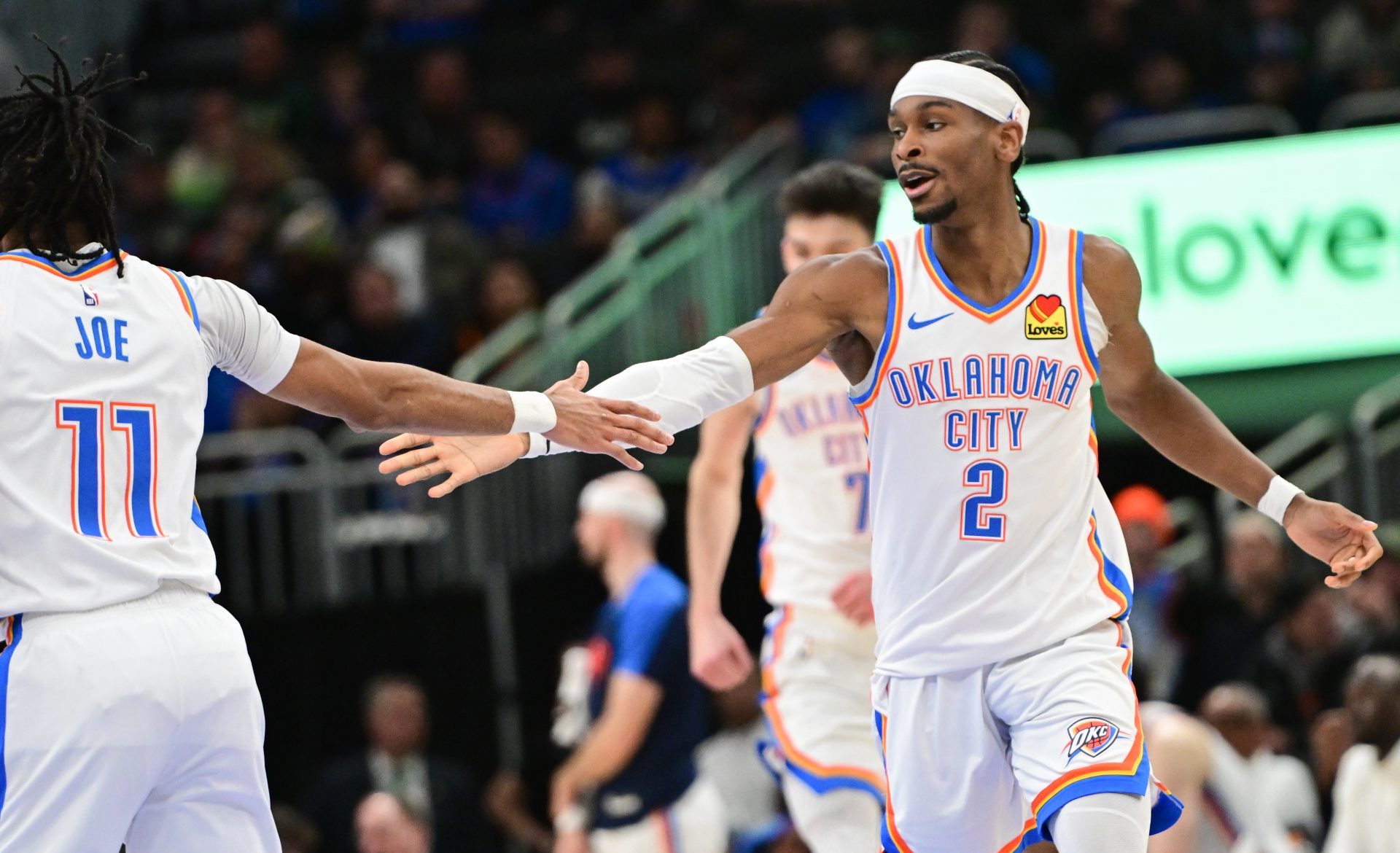 Mar 16, 2025; Milwaukee, Wisconsin, USA; Oklahoma City Thunder guard Shai Gilgeous-Alexander (2) celebrates with guard Isaiah Joe (11) after score in the fourth quarter against the Milwaukee Bucks at Fiserv Forum.