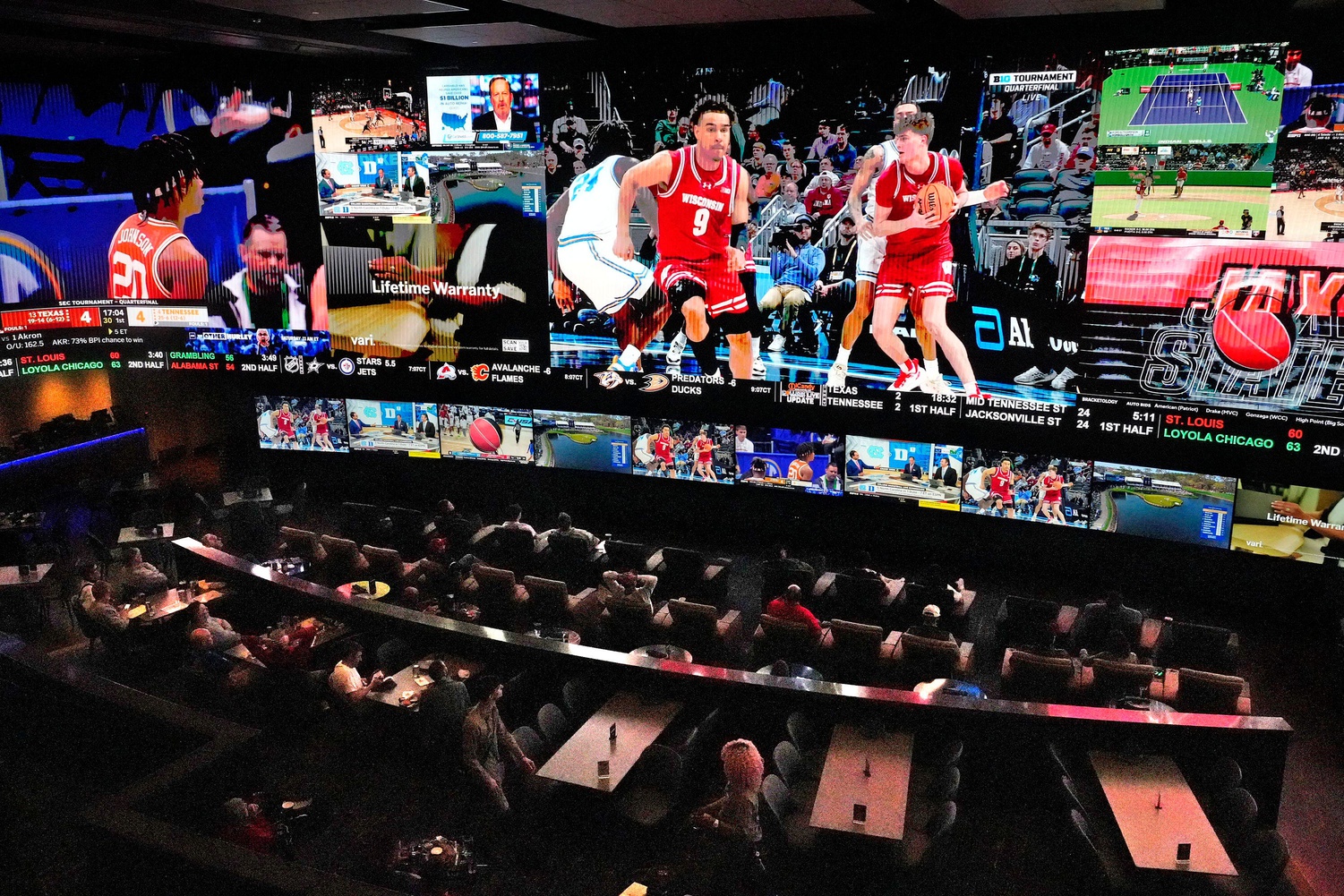 Potawatomi Sportsbook patrons watch the University of Wisconsin men play UCLA on Friday, March 14, 2025. The venue is open for the first time during March Madness and is expecting to be busy over the next few weeks in Milwaukee.