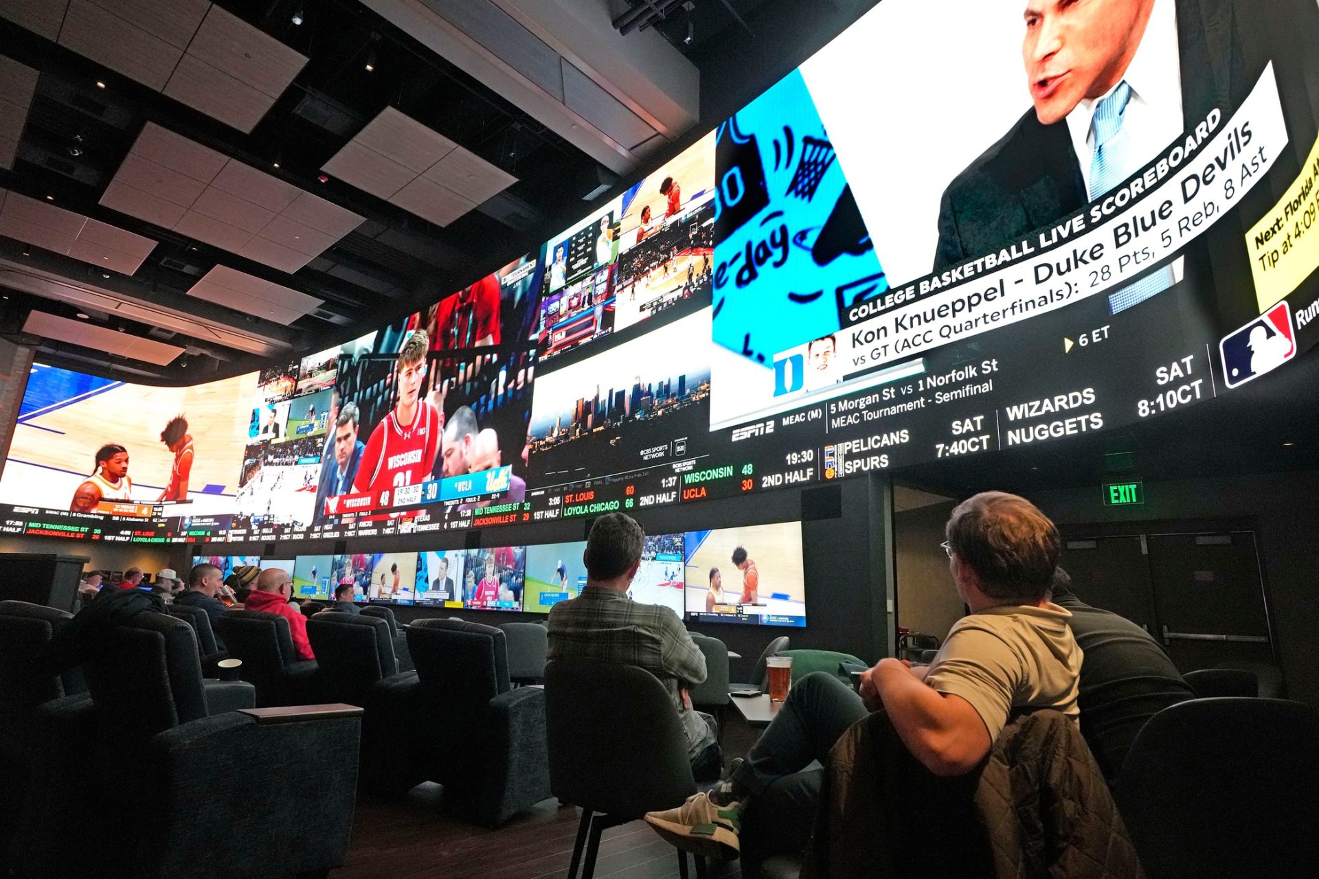 Potawatomi Sports Book patrons the University of Wisconsin men play UCLA on Friday, March 14, 2025. The venue is open for the first time during March Madness and is expecting to be busy over the next few weeks in Milwaukee.