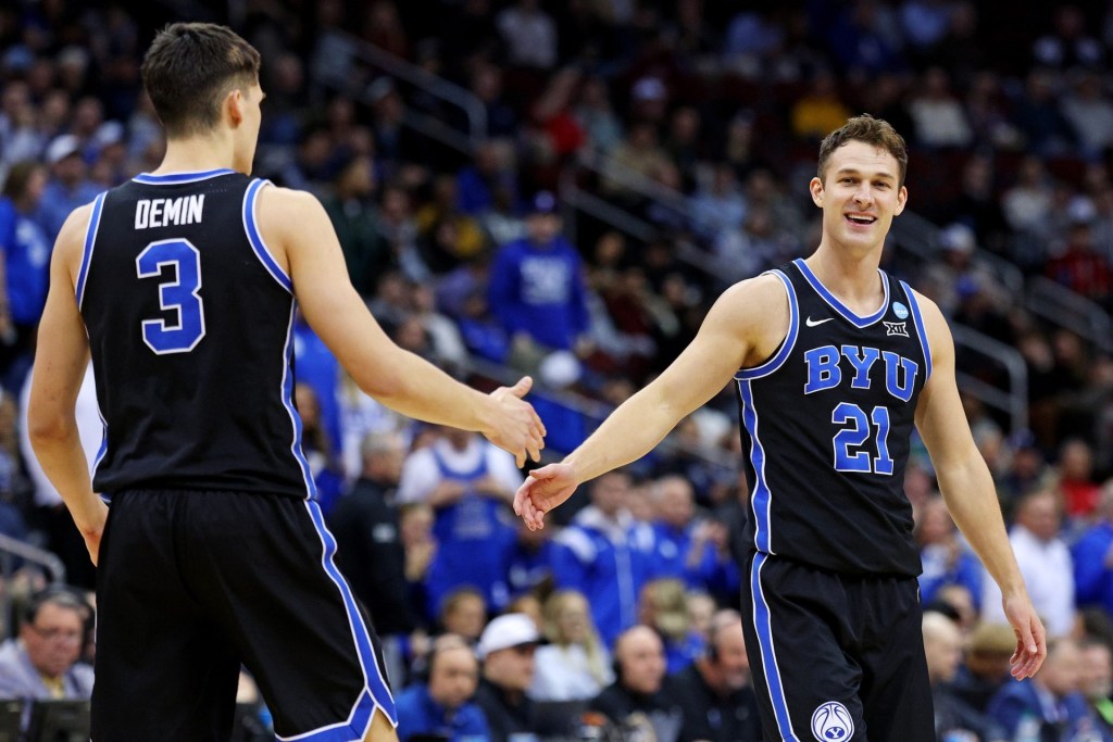 Mar 27, 2025; Newark, NJ, USA; Brigham Young Cougars guard Trevin Knell (21) celebrates with guard Egor Demin (3) during the first half against the Alabama Crimson Tide during an East Regional semifinal of the 2025 NCAA tournament at Prudential Center.