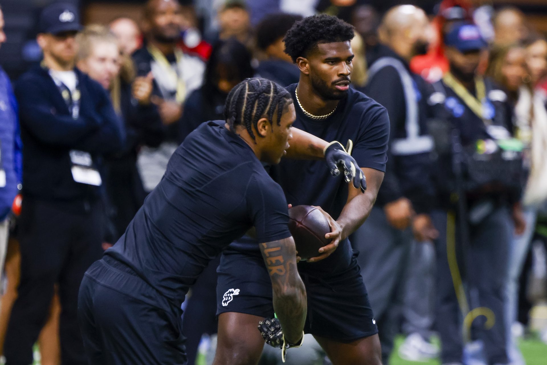 Apr 4, 2025; Boulder, CO, USA; Colorado Buffaloes quarterback Shedeur Sanders (2) runs drills at the University of Colorado NFL Showcase at the CU Indoor Practice Facility.