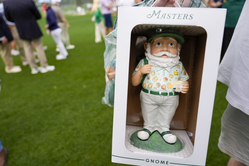 Apr 5, 2025; Augusta, Georgia, USA; A patron purchased merchandise including a gnome during the final round of the Augusta National Women's Amateur golf tournament at Augusta National Golf Club.