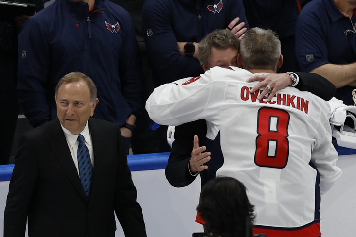Apr 6, 2025; Elmont, New York, USA; former Canadian-American ice hockey player Wayne Gretzky and Comissioner of the NHL Gary Bettman congratulates Washington Capitals left wing Alex Ovechkin (8) after scoring a goal in the 2nd period against the New York Islanders at UBS Arena. The goal is the 895th of Ovechkin’s career, breaking the NHL all-time career goals record previously held by Wayne Gretzky.at UBS Arena