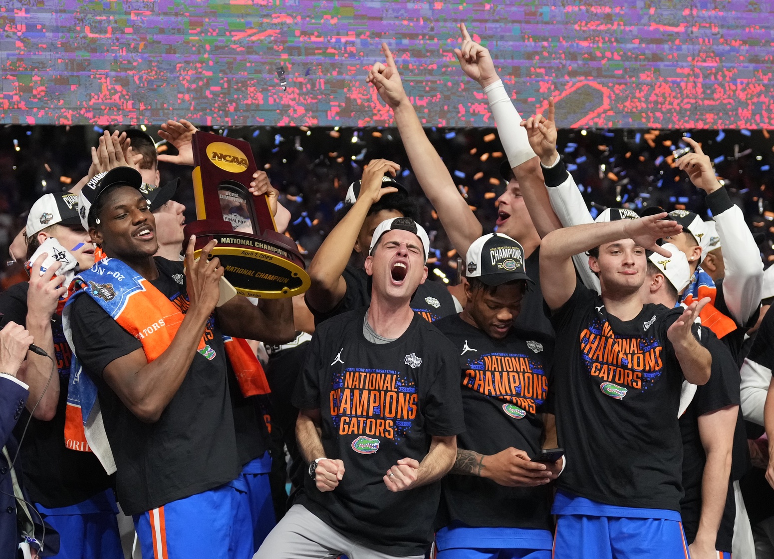 Apr 7, 2025; San Antonio, TX, USA; Florida Gators players hoist the trophy after defeating the Houston Cougars in the national championship game of the Final Four of the 2025 NCAA Tournament at the Alamodome.