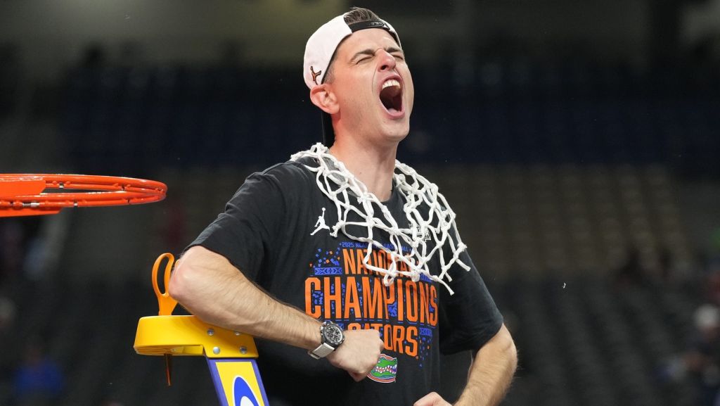 Apr 7, 2025; San Antonio, TX, USA; Florida Gators head coach Todd Golden celebrates as he cuts down the net after defeating the Houston Cougars in the national championship game of the Final Four of the 2025 NCAA Tournament at the Alamodome