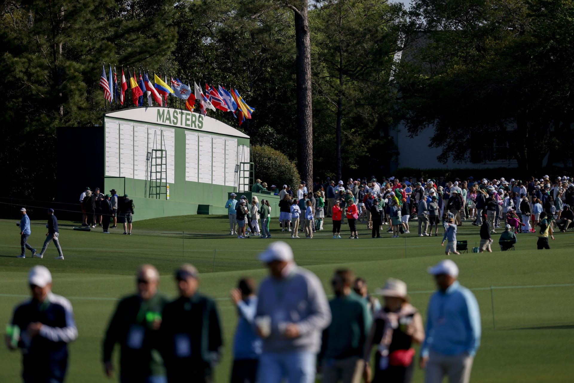 Apr 9, 2025; Augusta, Georgia, USA; Patrons move about the course during a practice round for the Masters Tournament at Augusta National Golf Club.