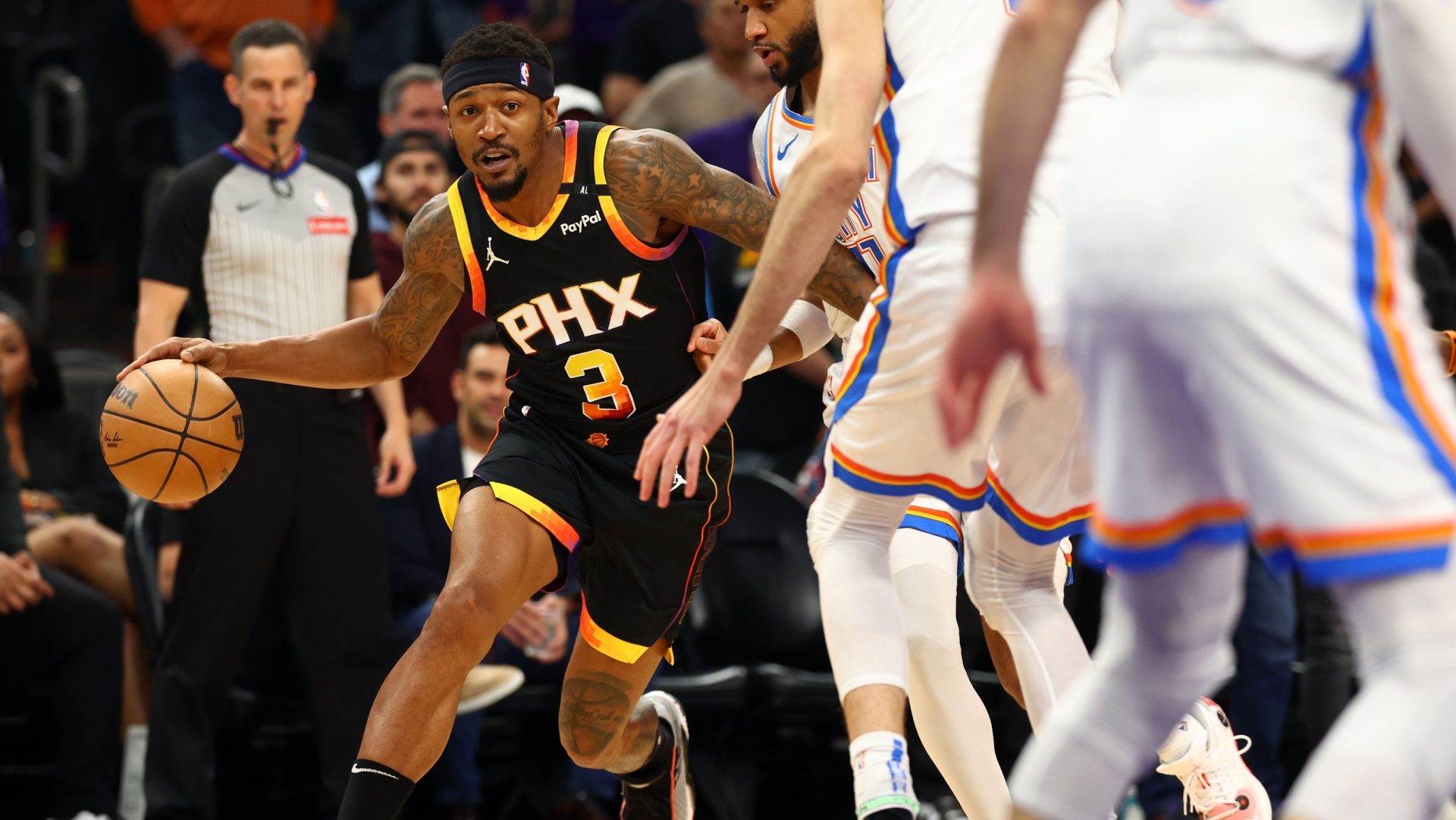 Apr 9, 2025; Phoenix, Arizona, USA; Phoenix Suns guard Bradley Beal (3) dribbles the ball against the Oklahoma City Thunder during the first half at Footprint Center.