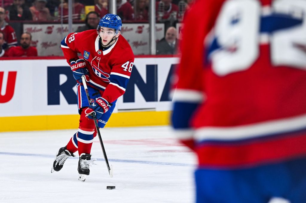 Apr 14, 2025; Montreal, Quebec, CAN; Montreal Canadiens defenseman Lane Hutson (48) plays the puck against the Chicago Blackhawks in the second period at Bell Centre.