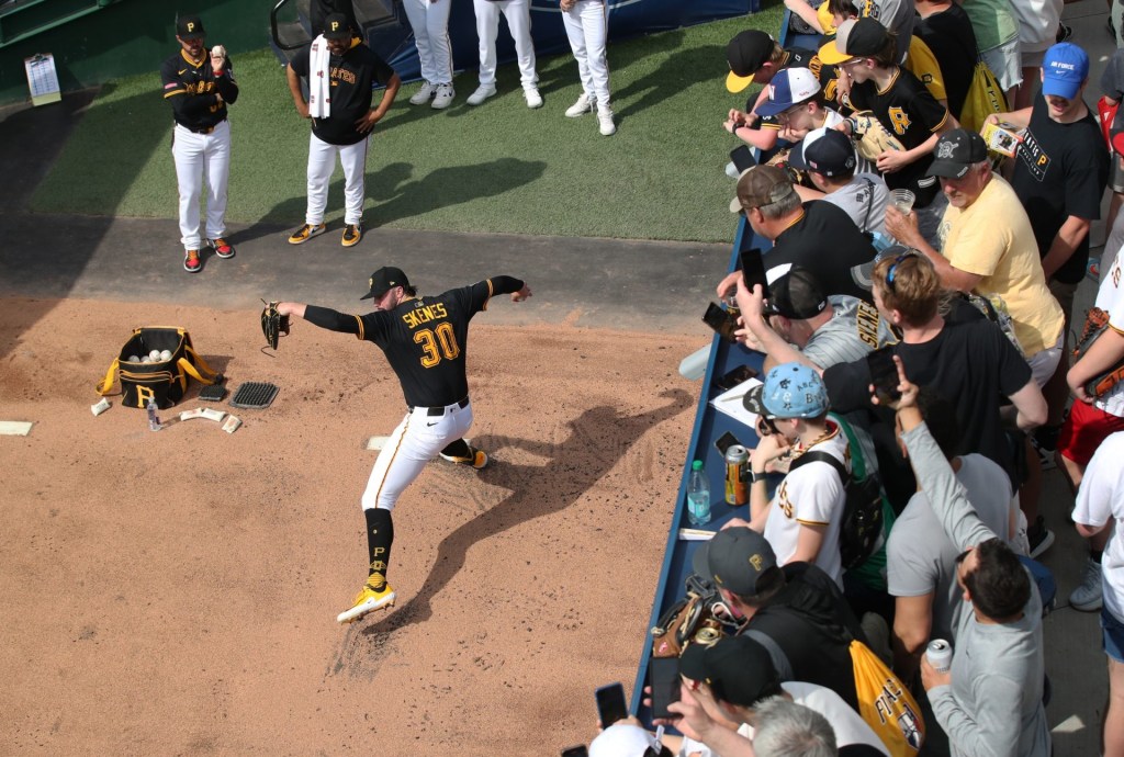Apr 19, 2025; Pittsburgh, Pennsylvania, USA;  Fans look on as Pittsburgh Pirates starting pitcher Paul Skenes (30) warms up in the bullpen before pitching against the Cleveland Guardians at PNC Park. Mandatory Credit: 