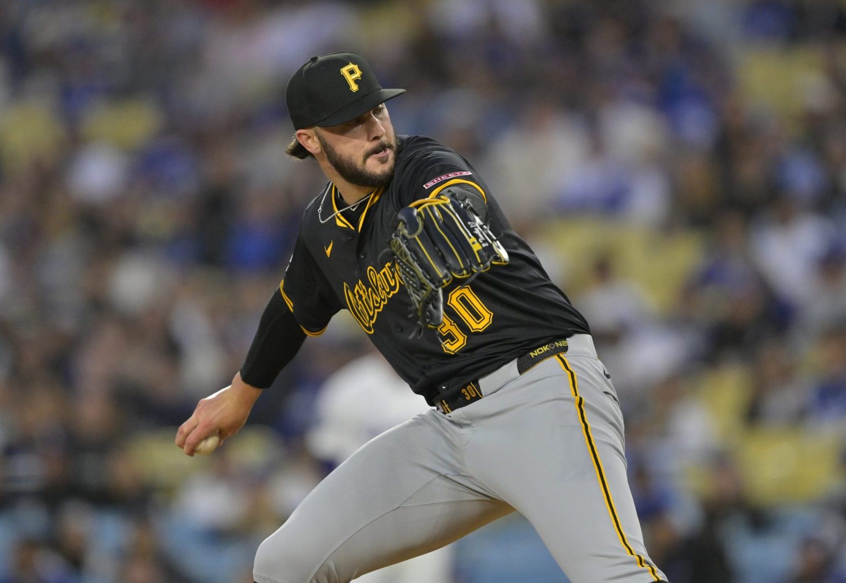 Apr 25, 2025; Los Angeles, California, USA; Pittsburgh Pirates starting pitcher Paul Skenes (30) pitches during the first inning against the Los Angeles Dodgers at Dodger Stadium