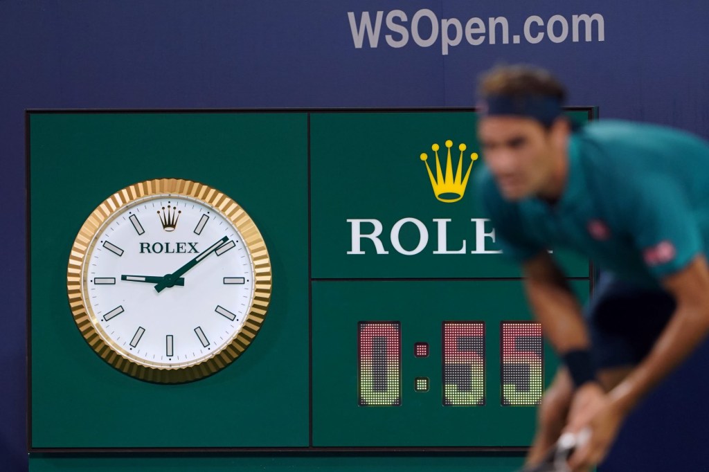 Aug 13, 2019; Mason, OH, USA; A view of the Rolex clock as Roger Federer (SUI) waits for the serve from Juan Ignacio Londero (ARG) during the Western and Southern Open tennis tournament at Lindner Family Tennis Center.