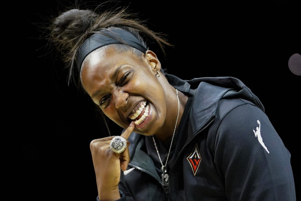 May 27, 2023; Las Vegas, Nevada, USA; Las Vegas Aces guard Chelsea Gray (12) poses with her championship ring prior to a game against the Los Angeles Sparks at Michelob Ultra Arena