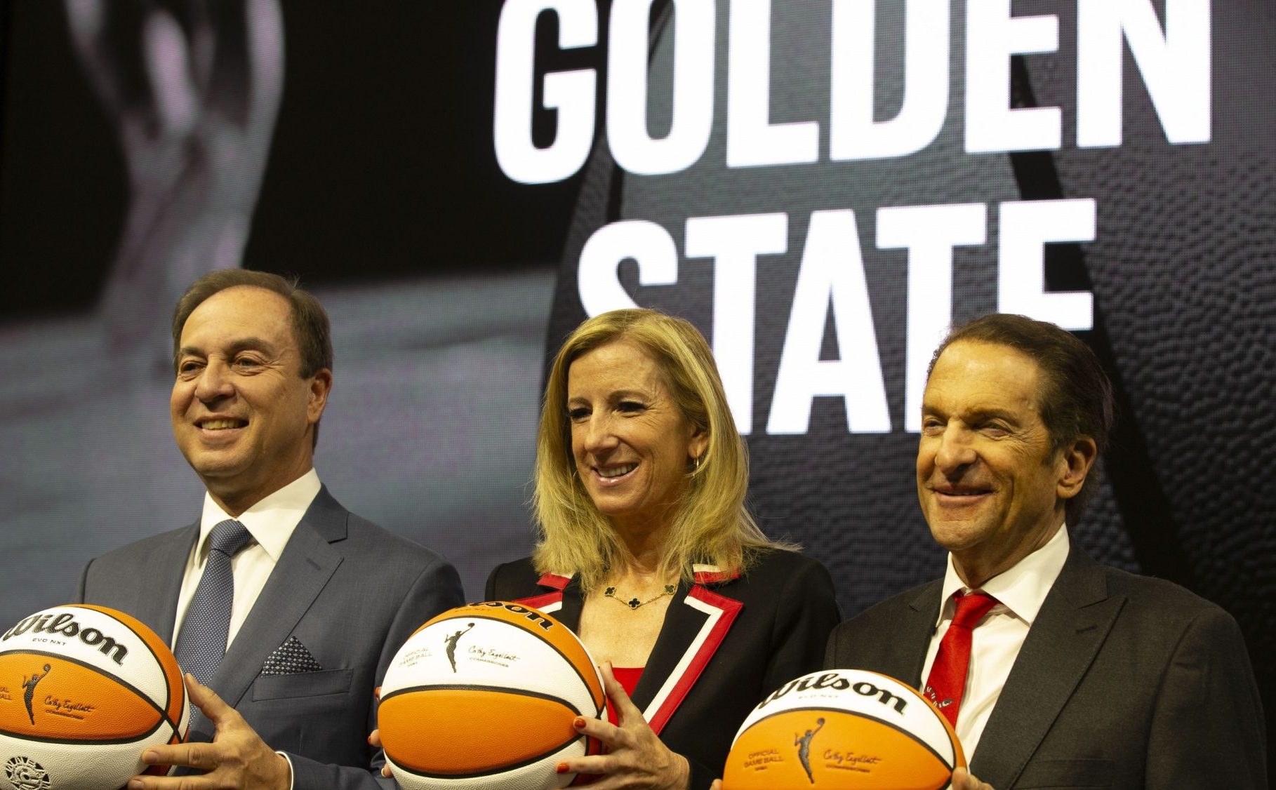 Oct 5, 2023; San Francisco, CA, USA; Golden State Warriors co-executive director & chief executive officer Joe Lacob, WNBA commissioner Cathy Engelbert and Warriors co-executive director Peter Guber pose for a group photo during a press conference to announce an expansion WNBA franchise in the San Francisco Bay Area at Chase Center.