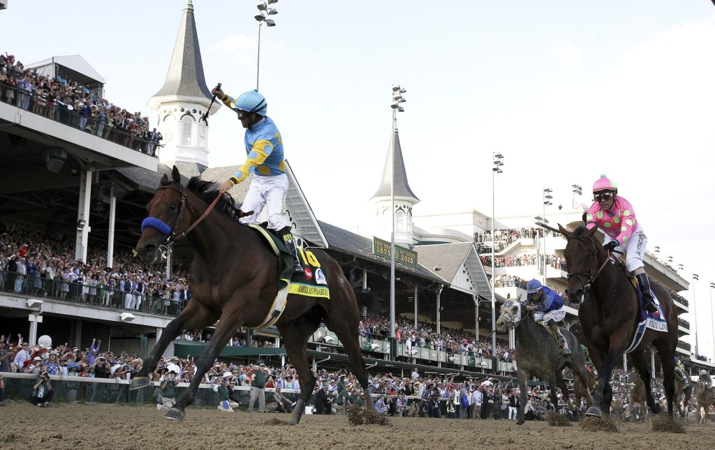 Victor Espinoza, aboard American Pharoah, celebrates after winning the Kentucky Derby on May 2, 2015.
Victor Espinoza, aboard Amercian Pharaoh, celebrates after winning the Kentucky Derby.
May 2, 2015