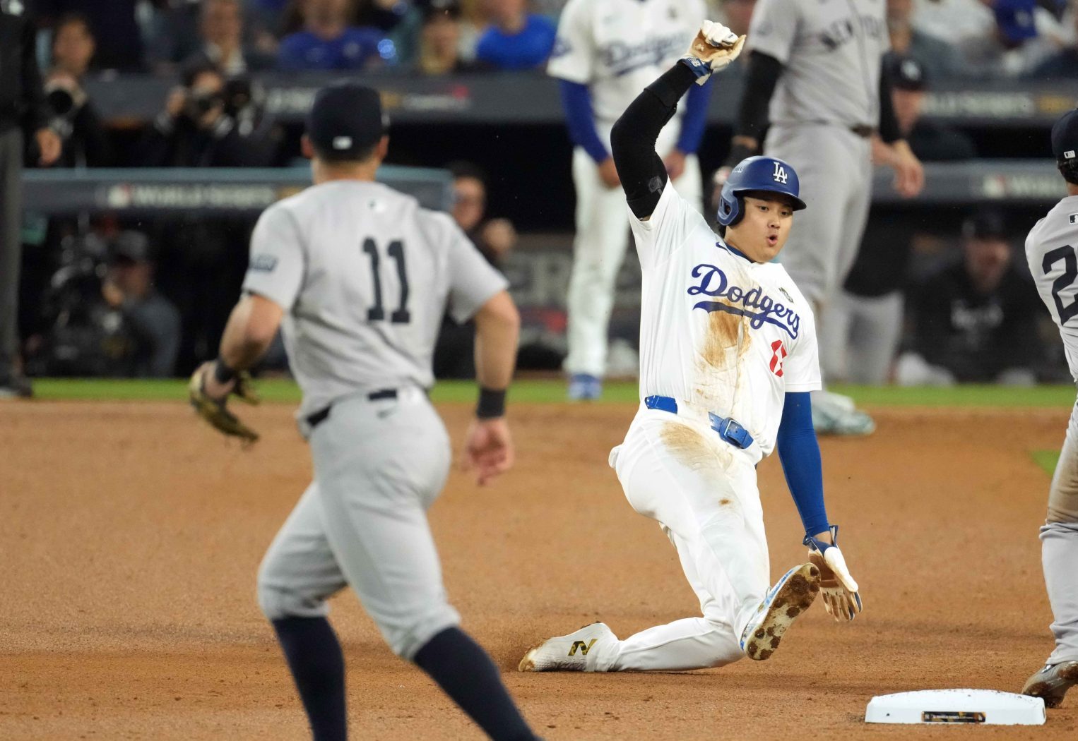 Oct 26, 2024; Los Angeles, California, USA; Los Angeles Dodgers designated hitter Shohei Ohtani (17) injures left shoulder whilte attempt to steal second base in the seventh inning against the New York Yankees during game two of the 2024 MLB World Series at Dodger Stadium.