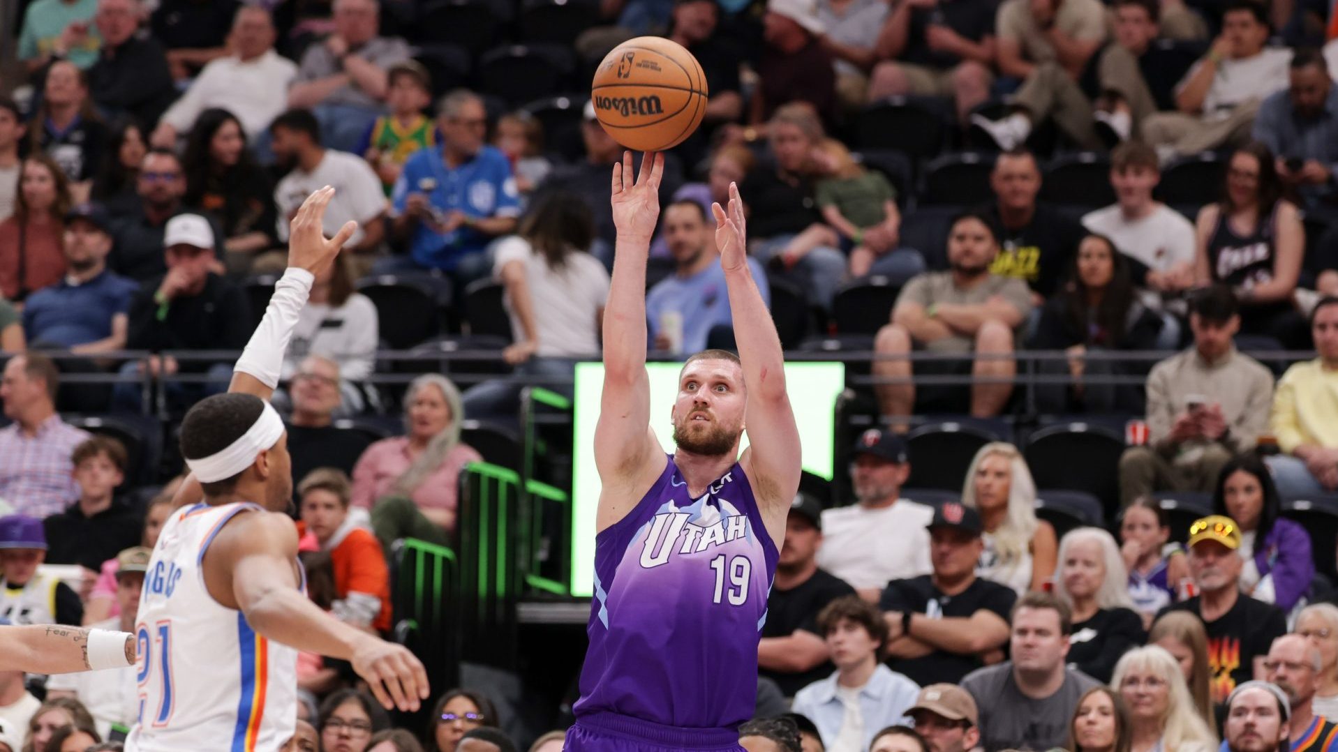 Apr 11, 2025; Salt Lake City, Utah, USA; Utah Jazz guard Svi Mykhailiuk (19) shoots the ball during the second half against the Oklahoma City Thunder at Delta Center.