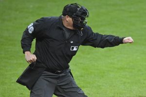 Apr 12, 2025; Cleveland, Ohio, USA; MLB umpire Ron Kulpa (46) calls a third strike during a game between the Cleveland Guardians and the Kansas City Royals at Progressive Field