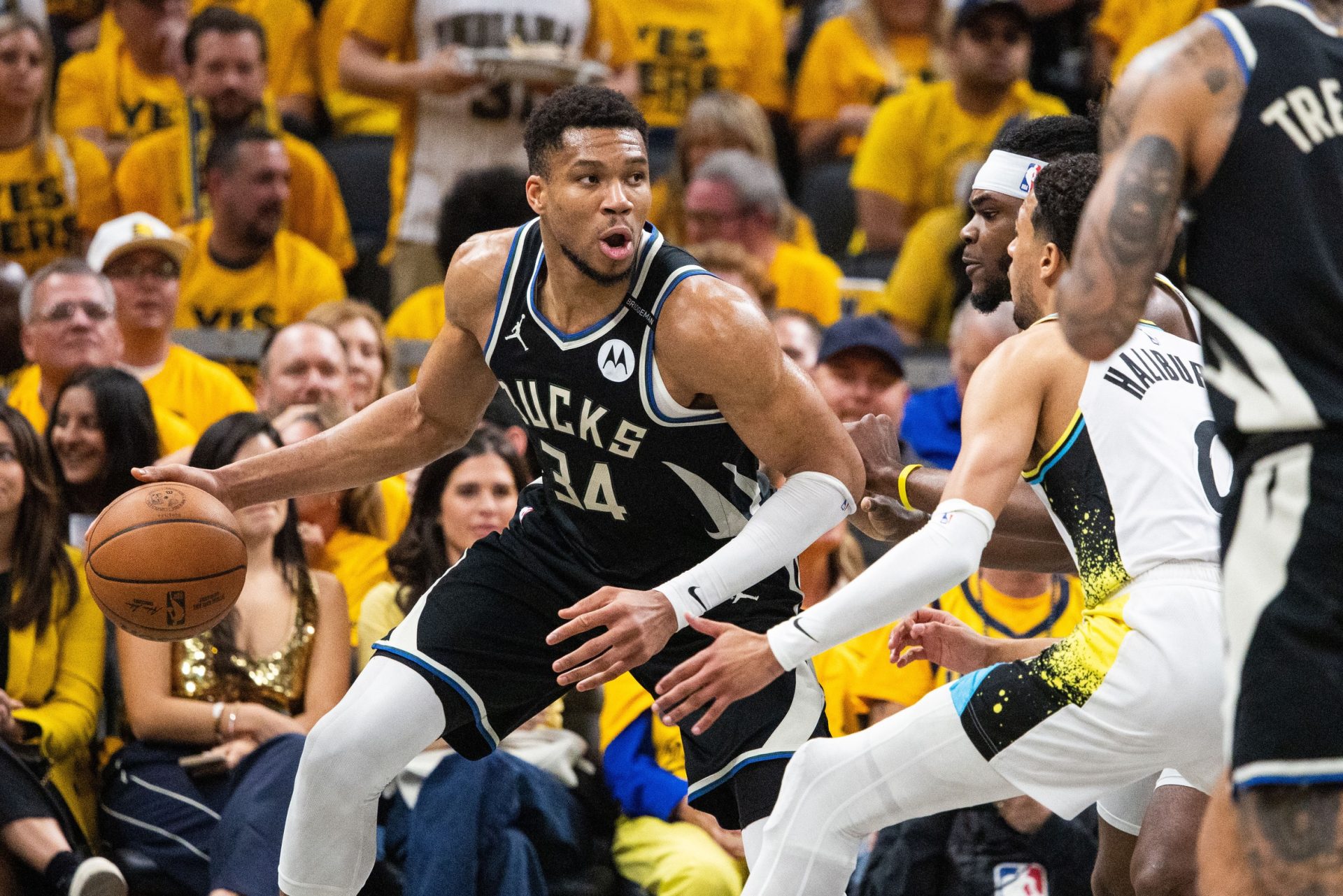 Apr 29, 2025; Indianapolis, Indiana, USA; Milwaukee Bucks forward Giannis Antetokounmpo (34) dribbles the ball while Indiana Pacers forward Jarace Walker (5) defends during game five of the first round for the 2024 NBA Playoffs at Gainbridge Fieldhouse.