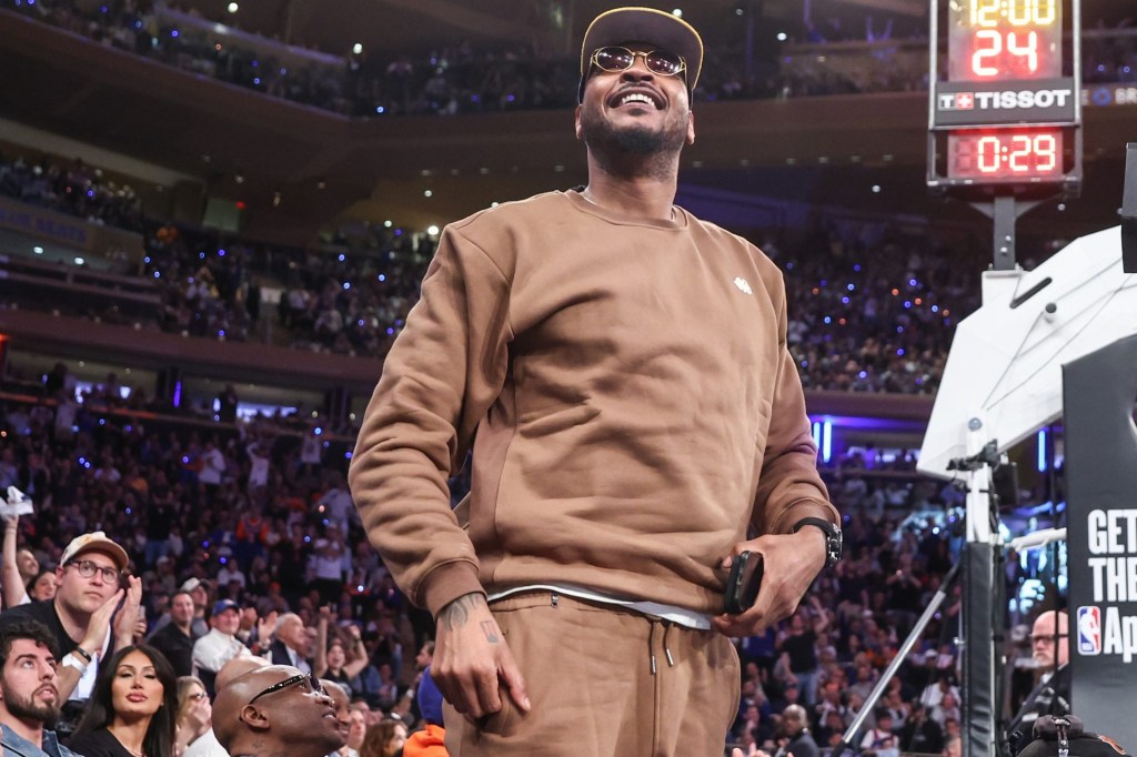 Apr 29, 2025; New York, New York, USA; Former NBA forward Carmelo Anthony waves to the crowd during game five of first round for the 2025 NBA Playoffs between the against the Detroit Pistons and the New York Knicks at Madison Square Garden. 