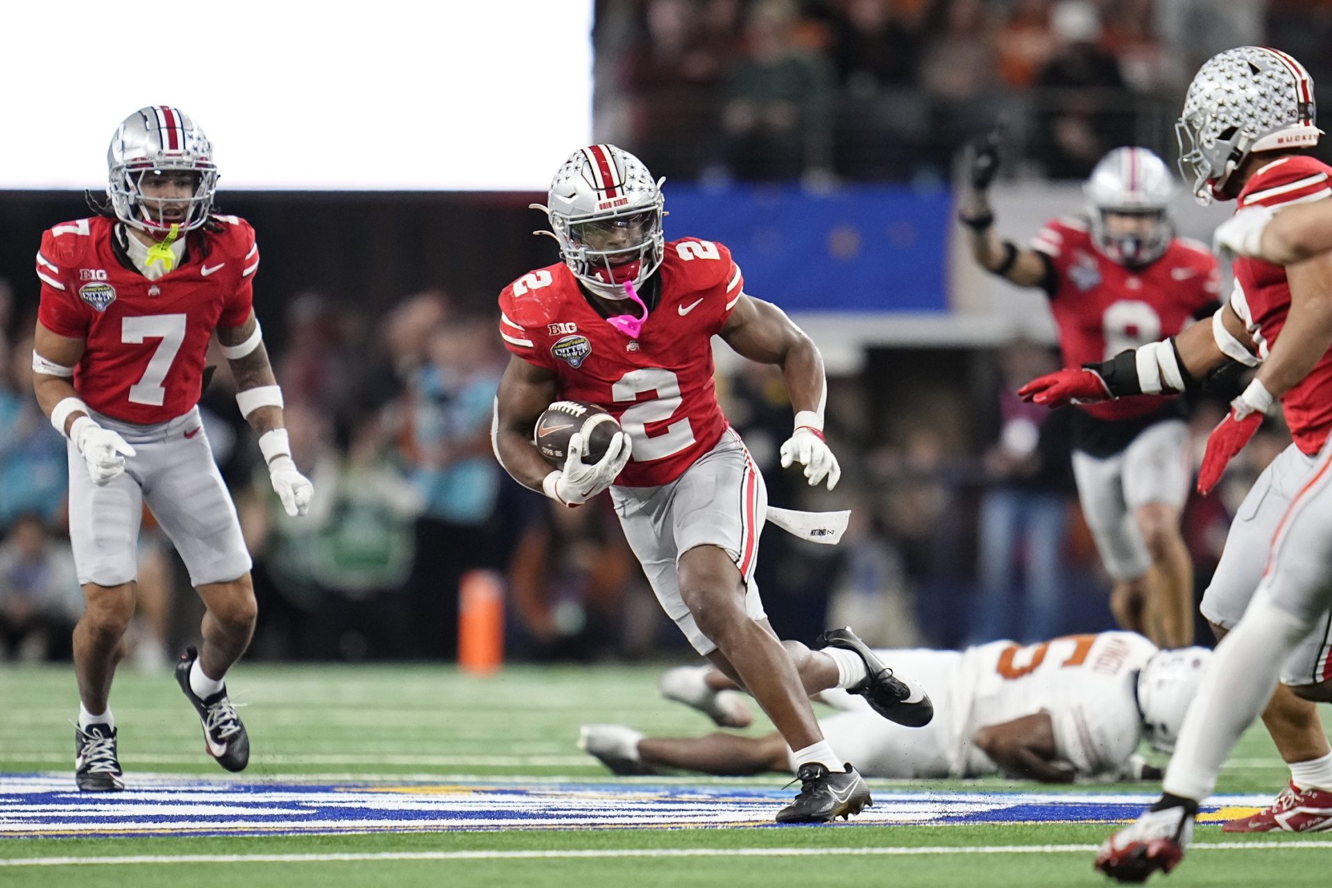 Ohio State Buckeyes safety Caleb Downs (2) returns an interception during the second half of the Cotton Bowl Classic College Football Playoff semifinal game against the Texas Longhorns at AT&T Stadium in Arlington, Texas on Jan. 10, 2025. Ohio State won 28-14.
